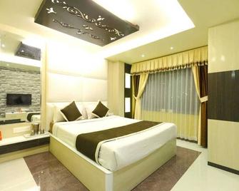 هوتل مانيك - أوتي - غرفة نوم