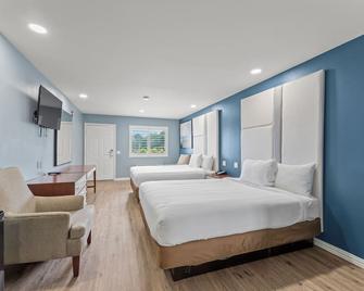 Executive Inn and Suites - Magnolia - Habitación