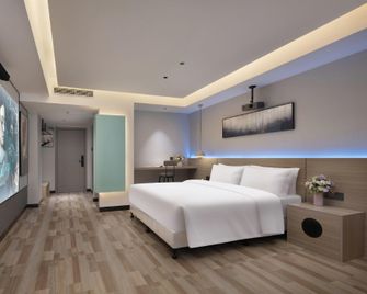 Xi Yue Huan Ying Hotel (Bubugao Xintiandi Branch) - Shaoyang - Bedroom
