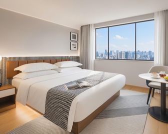 Manpo Smart S Hotel (Yichang Wuyi Square Riverside Branch) - Yichang - Schlafzimmer