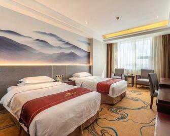Wanguo Mingyuan Business Hotel - Yulin - Bedroom
