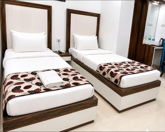 Hotel Kiran Residency - Tinsukia - Bedroom