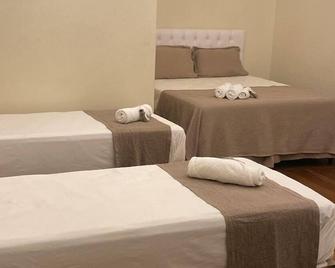 Pousada Encantos de Palmeiras - Palmeiras - Slaapkamer