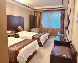 Wuyuan Ruiyi Xingjiangwan Holiday Hotel (Zhuzi Pedestrian Street) - Shangrao - Habitación