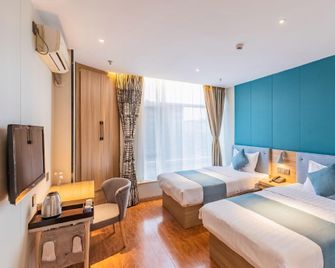 Shoulvrujia Yake Hotel (Xingtai Xueyuan Street Wanda) - Xingtai - Bedroom