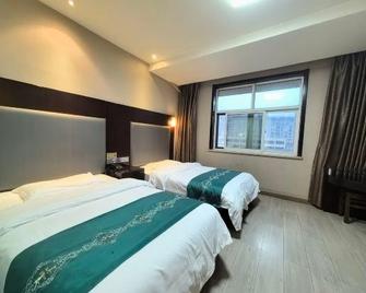 Juheng Hotel - Yan’an - Спальня