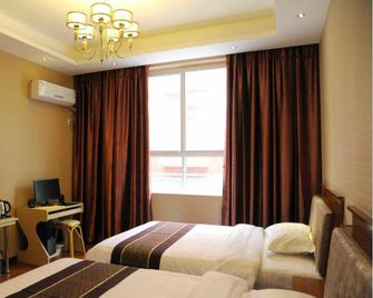 Minjiang Hotel - Leshan - Camera da letto
