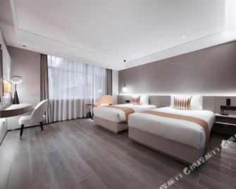 Ibis Styles Dalian Station Hotel - דאליין - חדר שינה