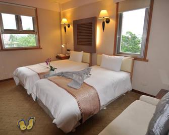 Tian Long Hotel - Jiaoxi - Schlafzimmer