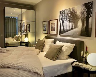 Cityhomemunich - München - Schlafzimmer