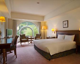 Le Midi Hotel Chitou - נאנטו סיטי - חדר שינה