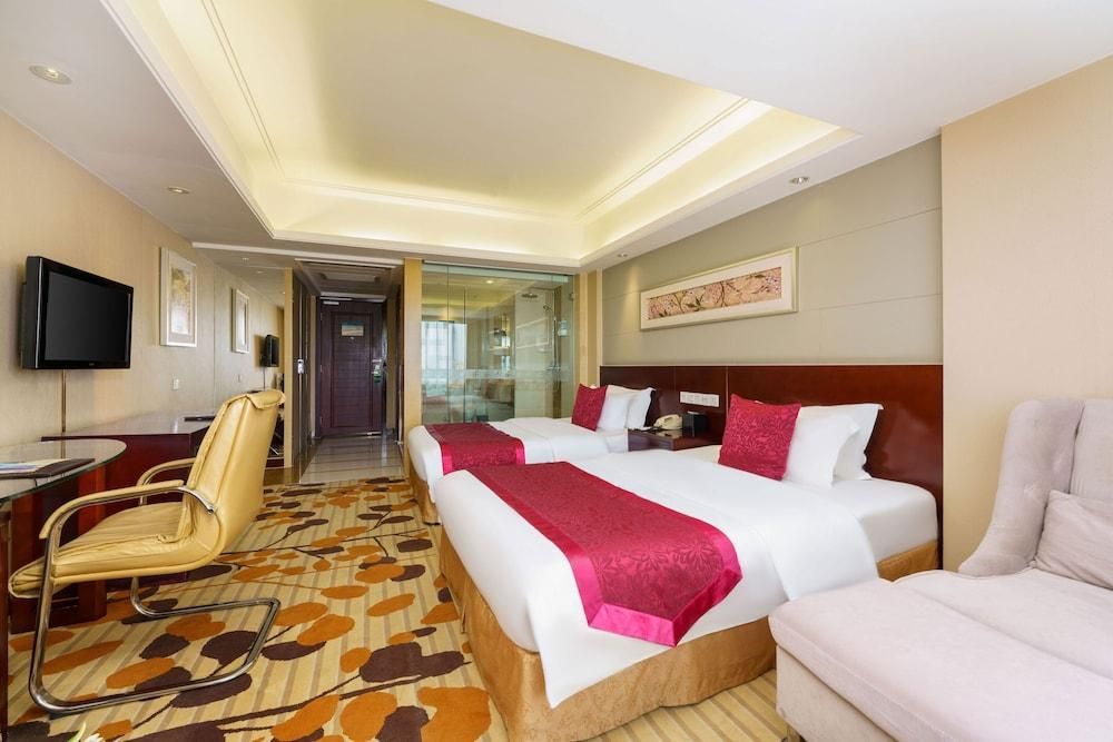 أورومشي بينغتوان غراند هوتل - أورومتشي - غرفة نوم