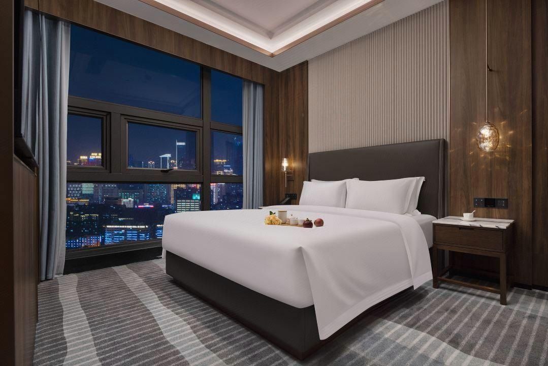 Kang Nian Shi Jia Hotel - تشانغشا - غرفة نوم