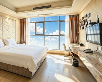 Yijia City Hotel (Mianyang Tieniu Square) - Mianyang - Schlafzimmer