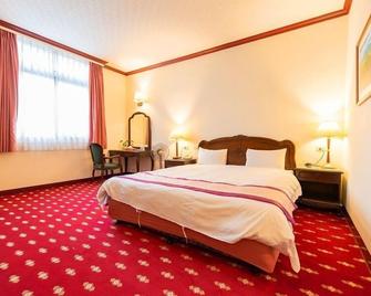 East Commercial Affairs Hotel - Luodong Township - Bedroom