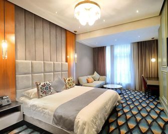 โรงแรมและที่พักที่รูมิ - ดชานเบ - ห้องนอน
