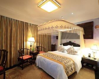 Jindu Crown Hotel - נאנצ'אנג - חדר שינה