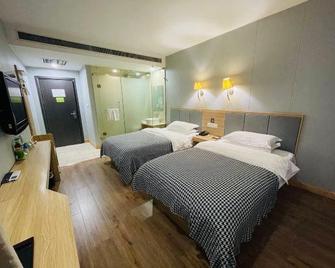 Huayi Commercial Hotel - Jiyuan - Habitación
