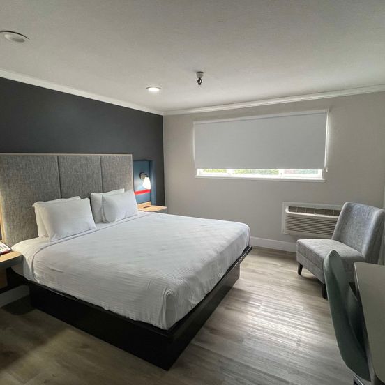 Bedroom view of The Midtowner Hotel, SureStay Collection by Best Western