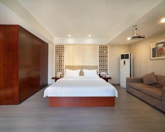 Yiju Hotel (Chongqing Huaxi Culture and Sports Center Dajiang Light Rail Station) - Chongqing - Habitación