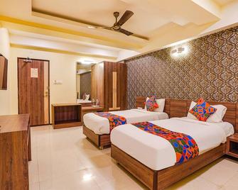 Fabhotel Ginger Suites - Chandapura - Bedroom