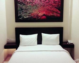 Wisata Hotel Banjarmasin - バンジ ャ ルマシン - 寝室