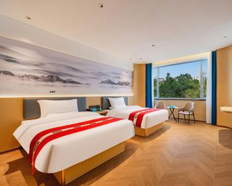 Zhongwei Xinhua Shuyue Zhenxuan International Hotel (Gulou East Street Branch, Shapotou District) - Zhongwei - Schlafzimmer