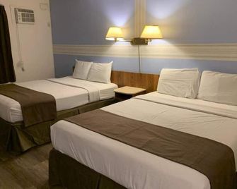 Swiss Sunset Inn - Penticton - Bedroom