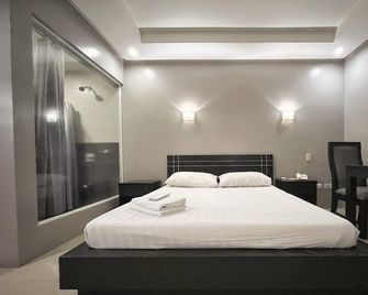 Rumi Apartelle Hotel - Angeles City - Bedroom