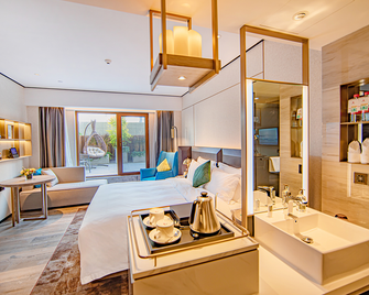 Echarm Plus Hotel Xiangyang Minfa Century New Town - Xiangyang - Bedroom