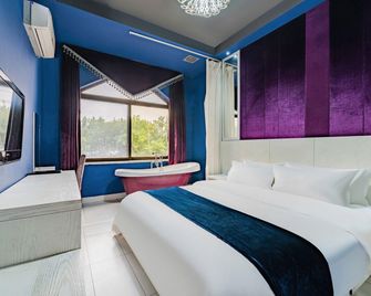 Shangchao Boutique Hotel ( Dongying District Huanghe Road Branch) - Dongying - Bedroom