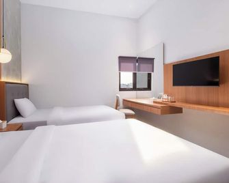 Omni Rooms by Sinergi - Semarang - Yatak Odası