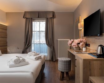 X Alp Hotel - Pozza di Fassa - Yatak Odası