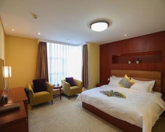 Qingdao Tianrun Jinwang Hotel - Qingdao - Bedroom
