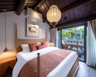 Beijing Lezai Nanluo Boutique Hotel - Pekín - Habitación