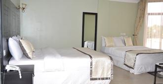 Panone Motel K.I.A - Arusha - Habitación