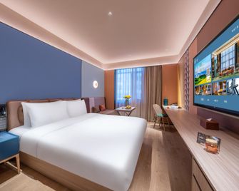 Orange Hotel Urumqi Youhao Medical College - Ürümqi - Soverom
