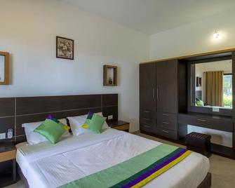 Treebo Majestic Retreat - Varkala - Slaapkamer