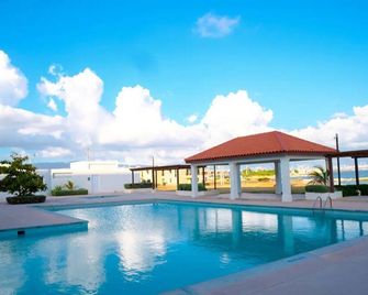 Our beautiful property boast a swimming pool, private beach , basketball court . - Portmore - Pool