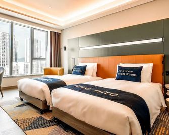 Mustel Hotel Knowledge City Guangzhou - Dongguan - Schlafzimmer