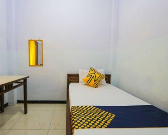 Hotel O Sumpil Syariah - Malang - Schlafzimmer