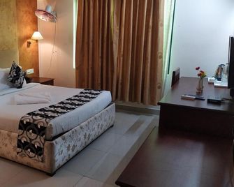 Bessota International - Tiruvalla - Bedroom