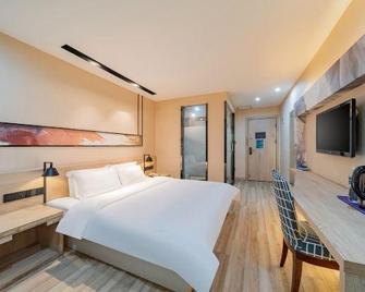 Rest Motel(Yancheng Tongma Store) - Yancheng - Schlafzimmer