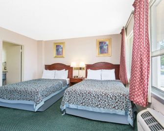 Days Inn and Suites by Wyndham Wichita East - Wichita - Kamar Tidur