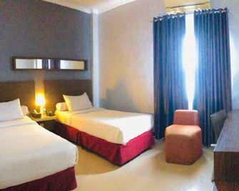 Agung Hotel Kendari - Kendari - Habitación
