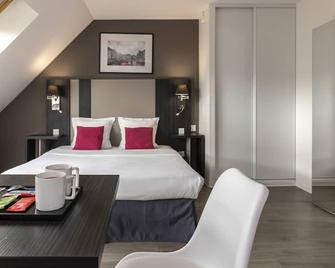 أوداليز سيتي كولمار لا روز دارجون - كولمار - غرفة نوم