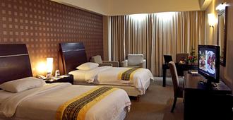 Grand Elite Hotel Pekanbaru - Pekanbaru - Bedroom
