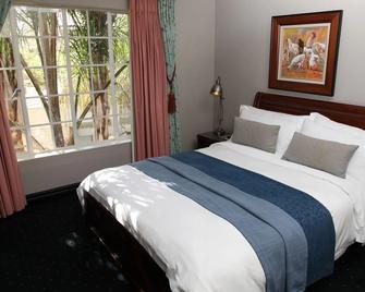 Village Ridge Boutique Stays - Pretoria - Bedroom