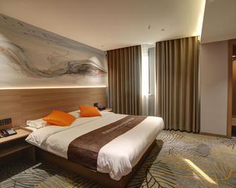 Daqing Weige Hotel (Daqing East Station) - Daqing - Bedroom