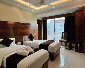 Hotel Rest Inn - Surat - Habitación